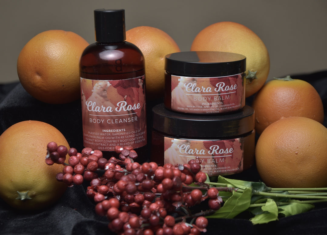 a-group-of-oranges-and-a-group-of-bottles-body-balm